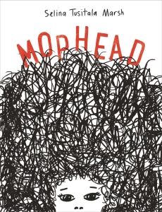 A woman with a huge and wild head of hair .